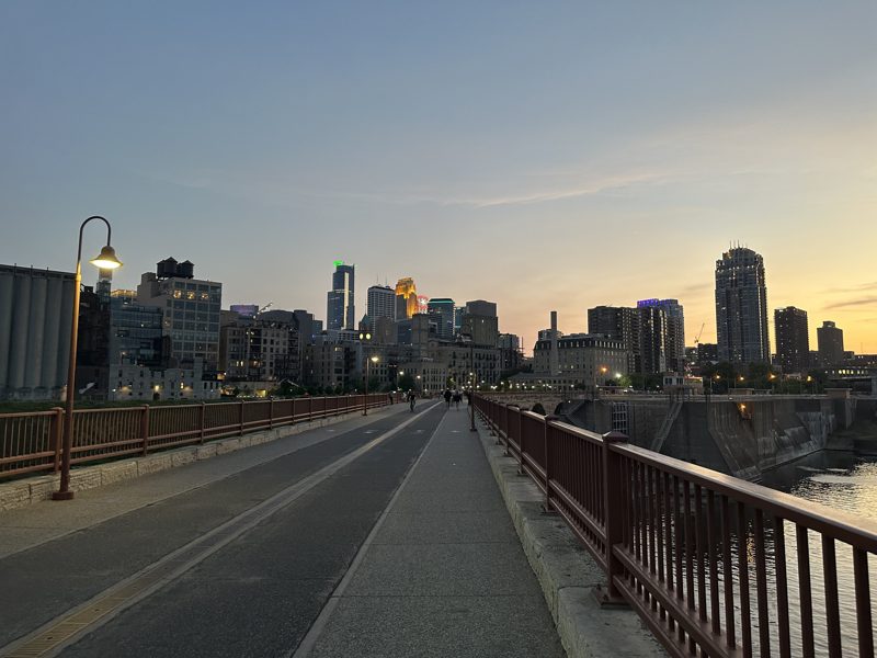 Minneapolis skyline at dusk from the Stone Arch Bridge